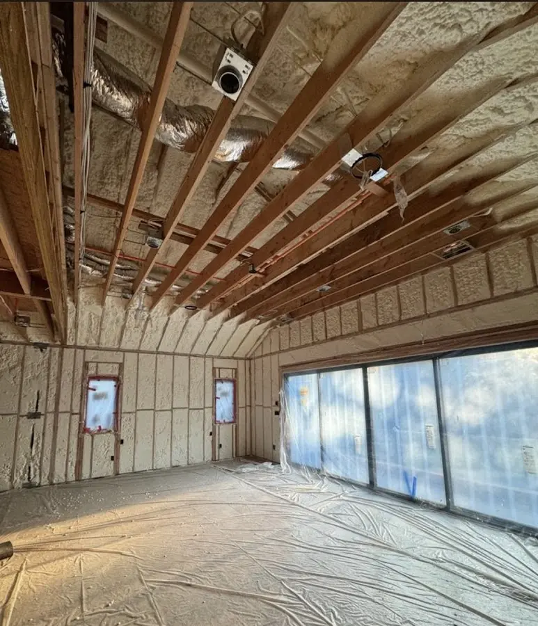 Interior walls and ceiling insulated with spray foam during new construction in Davidson